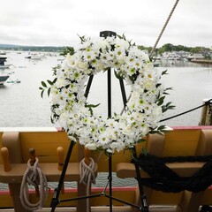 White floral memorial wreath onboard Mayflower II.