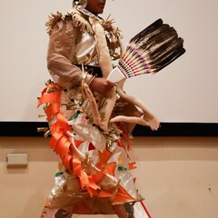A member of Standing Quiver Singers dances on stage during the Winter Fine Arts and Crafts Fair.
