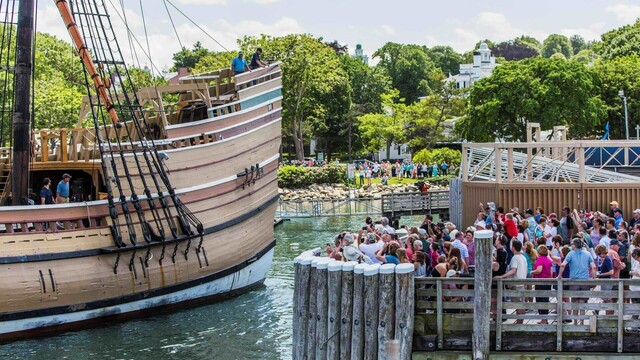 A large crowd welcomes Mayflower II as it arrives at the State Pier in Plymouth.