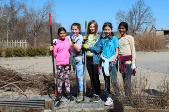Young volunteers craft center clean up day
