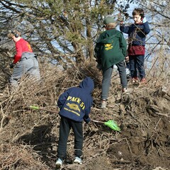 Young volunteers yard work clean up day
