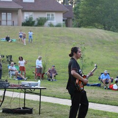 Guitar player lawn indigenous voices series concert