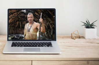 Indigenous Educator wearing regalia on computer screen.