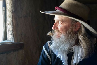 Pilgrim man fortmeeting house window gazing