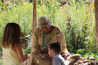 Indigneous museum educator homesite shade arbor