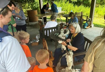 Volunteer spinner craft center pavilion enthralling a family