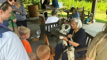 Volunteer spinner craft center pavilion enthralling a family