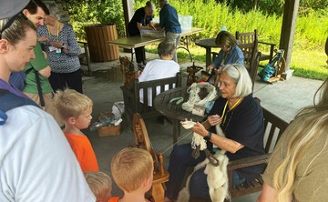 Volunteer spinner craft center pavilion enthralling a family