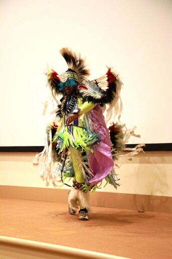 A member of Standing Quiver demonstrates a dance.