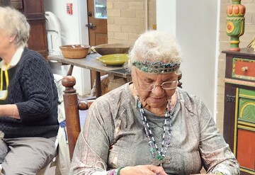 Indigenous Museum Educator demonstrates Indigenous craft