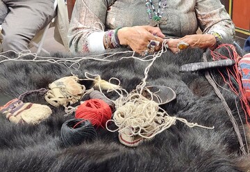 Indigenous Museum Educator demonstrates Indigenous craft