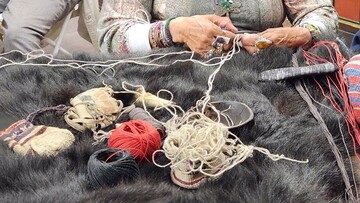 Indigenous Museum Educator demonstrates Indigenous craft