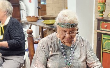 Indigenous Museum Educator demonstrates Indigenous craft