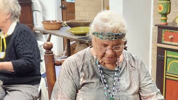 Indigenous Museum Educator demonstrates Indigenous craft