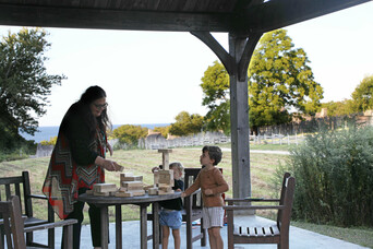 BNOTW kids playing Jenga with the ocean view