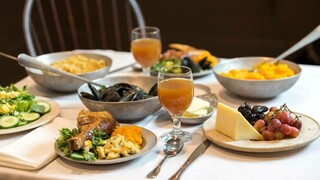 Thanksgiving table set with food inspired by historical recipes