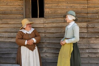 Two pilgrim women talking