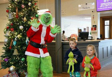Kids pose with the Grinch