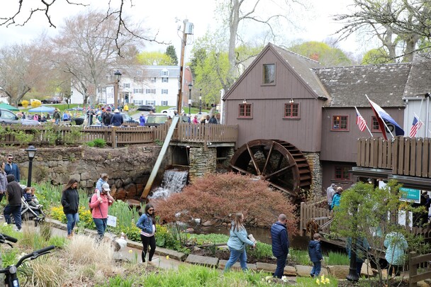 Guests walk the entrance path to Plimoth Grist Mill in early Spring.