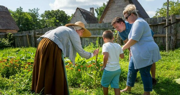 Parents and young son in a garden with a Pilgrim