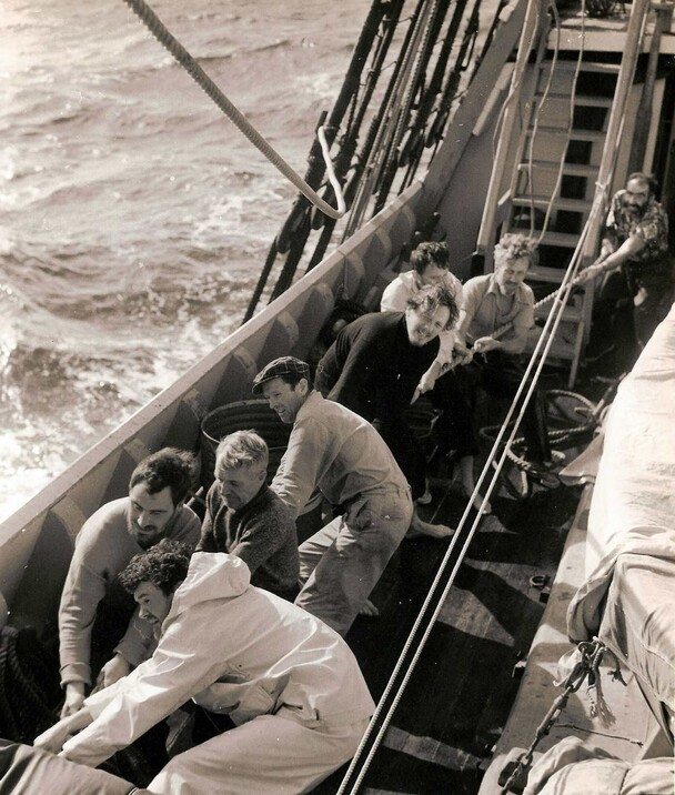 Crew pulling rope on deck of Mayflower