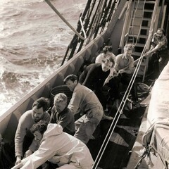 Crew pulling rope on deck of Mayflower