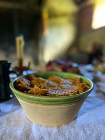 Stewed pompion in a large dish on a set table