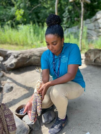 Museum educator displays corn at Historic Patuxet Homesite