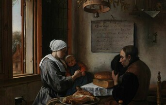 Family of three sit in a simple, Dutch interior, and pray before a meal of bread, cheese and ham.