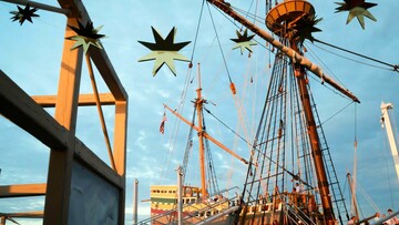 Mayflower II from exhibit dock with event decor.