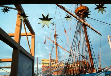 Mayflower II from exhibit dock with event decor.