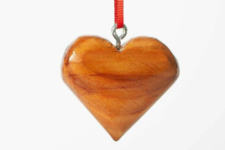 Wooden heart ornament with red string
