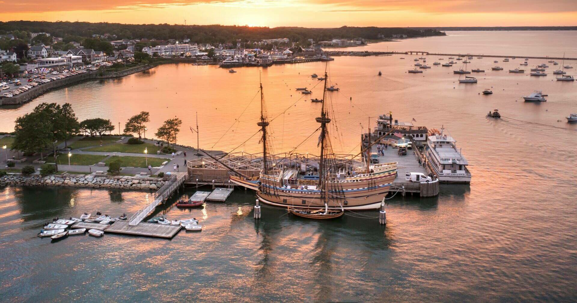 Ariel view of Mayflower II docked in downtown Plymouth at sunset